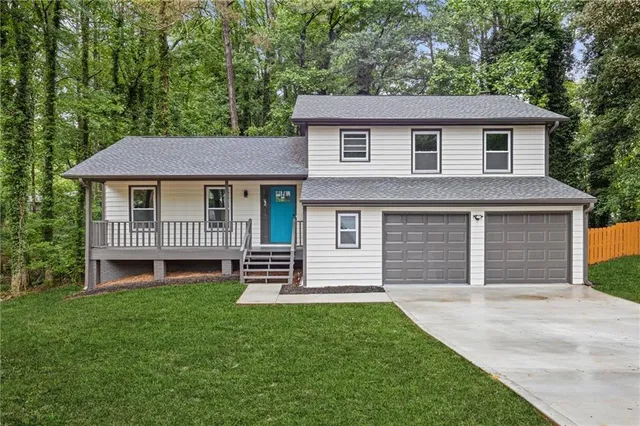 a front view of a house with a yard