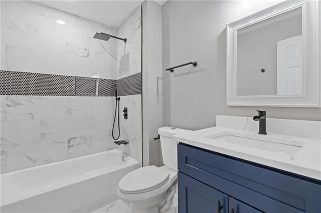 a bathroom with a sink a toilet and a bathtub