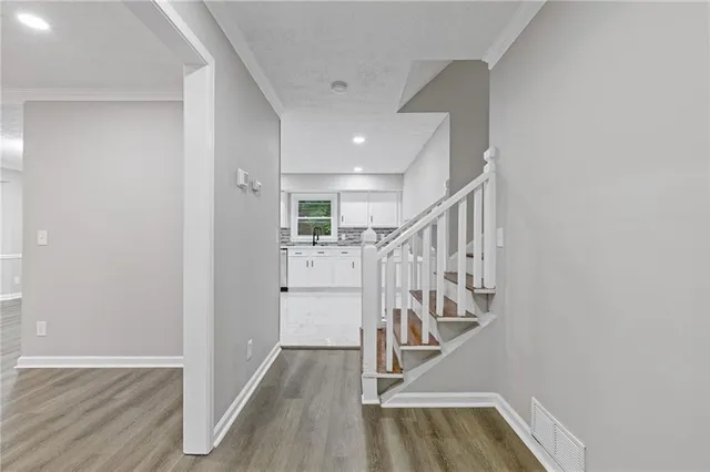 a view of entryway with wooden floor