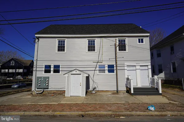 a front view of a house with garage