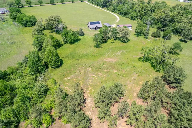 a view of a garden with a building