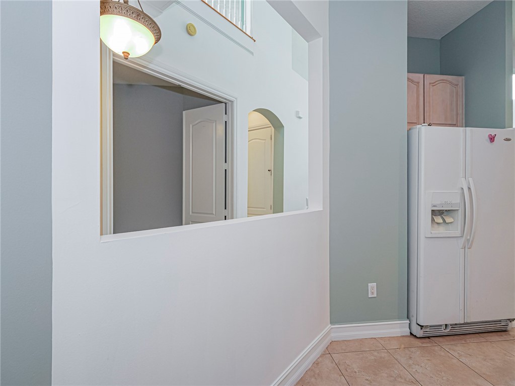 1835 Bridgepointe Circle, Unit 18 Vero Beach, FL 32967 - Photo 11 of 34 a view of a livingroom with a window