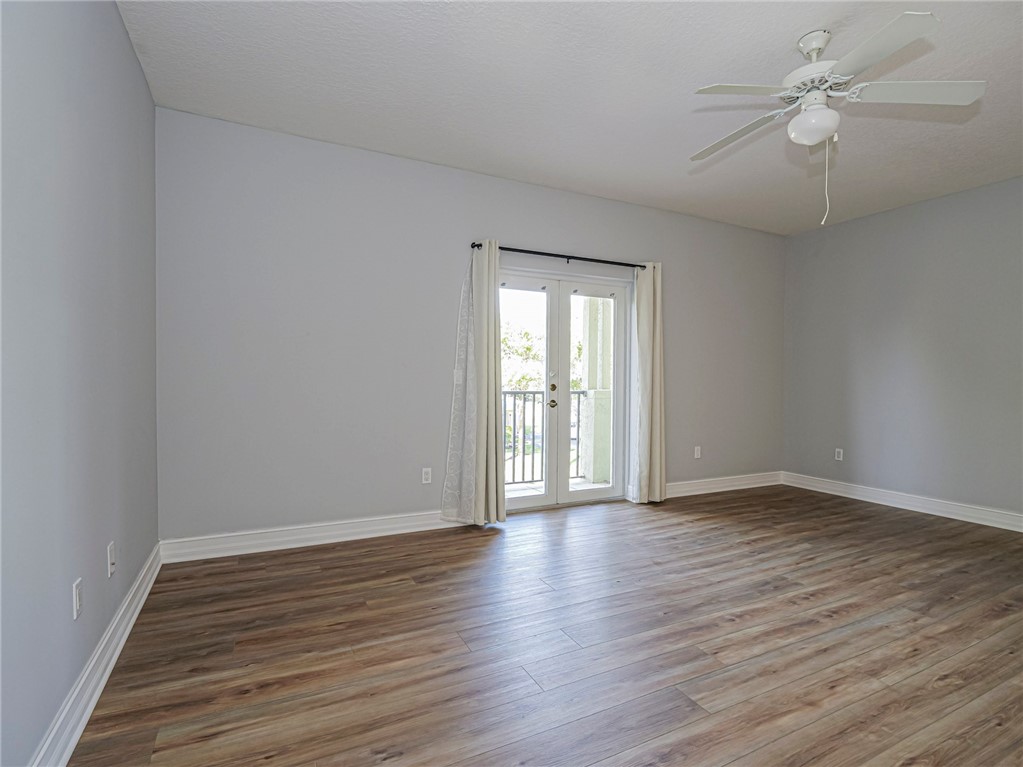 1835 Bridgepointe Circle, Unit 18 Vero Beach, FL 32967 - Photo 18 of 34 wooden floor in an empty room with a window