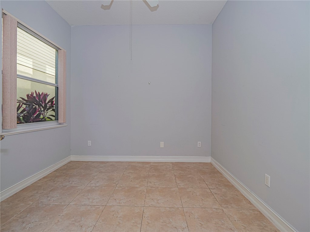 1835 Bridgepointe Circle, Unit 18 Vero Beach, FL 32967 - Photo 4 of 34 a view of an empty room with a window