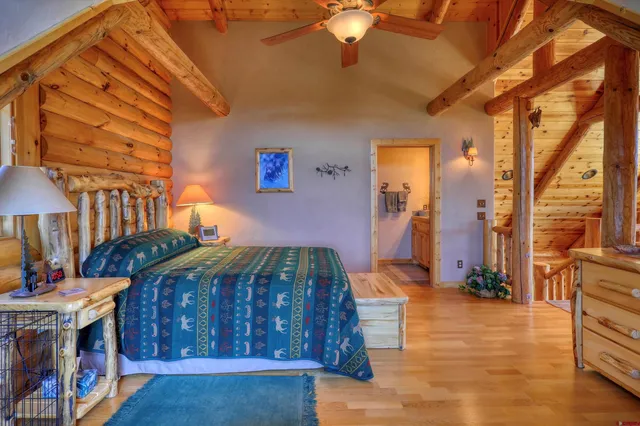 a bedroom with furniture and a chandelier