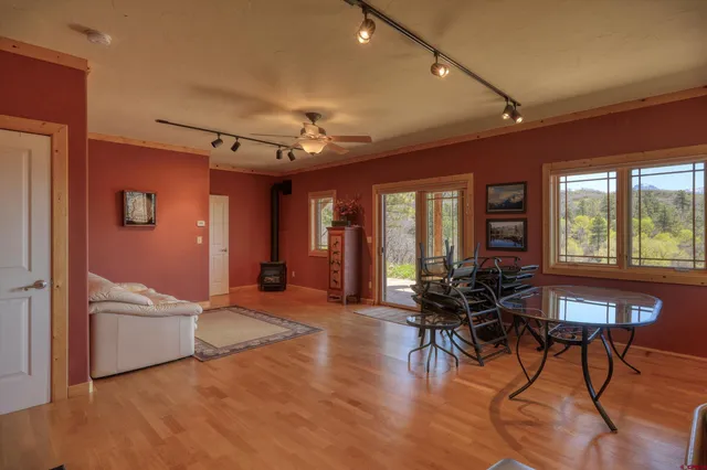 a view of a livingroom with furniture window and wooden floor