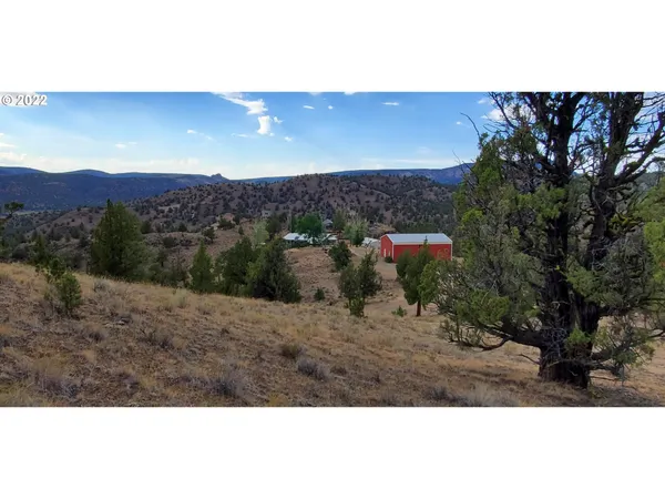 a bathroom with a toilet and a mirror