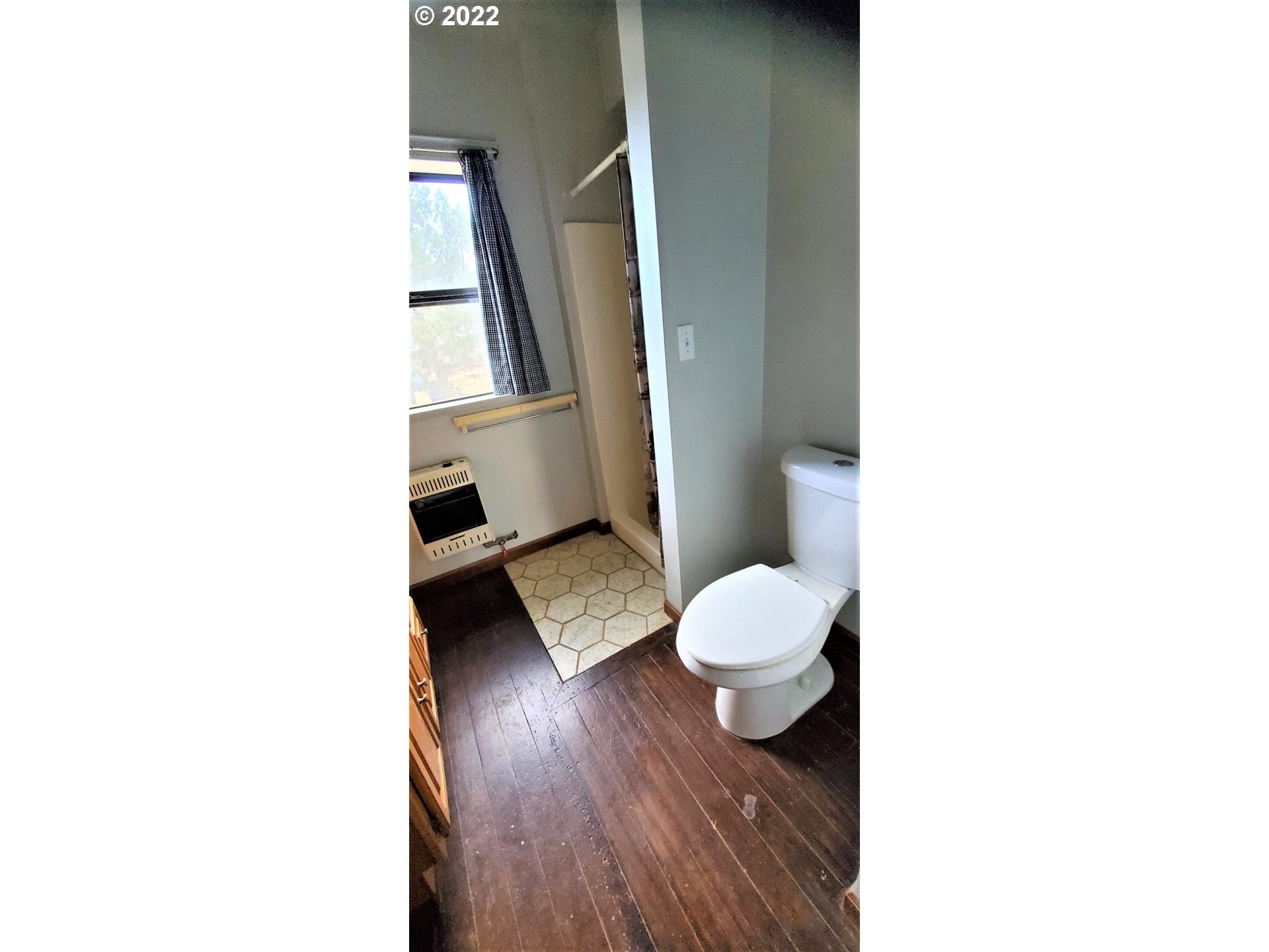 18990 Southeast Doubtful Dirt Road Prineville, OR 97754 - Photo 25 of 32 a bathroom with a toilet and a mirror