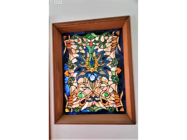 a kitchen view with wooden floor and electronic appliances