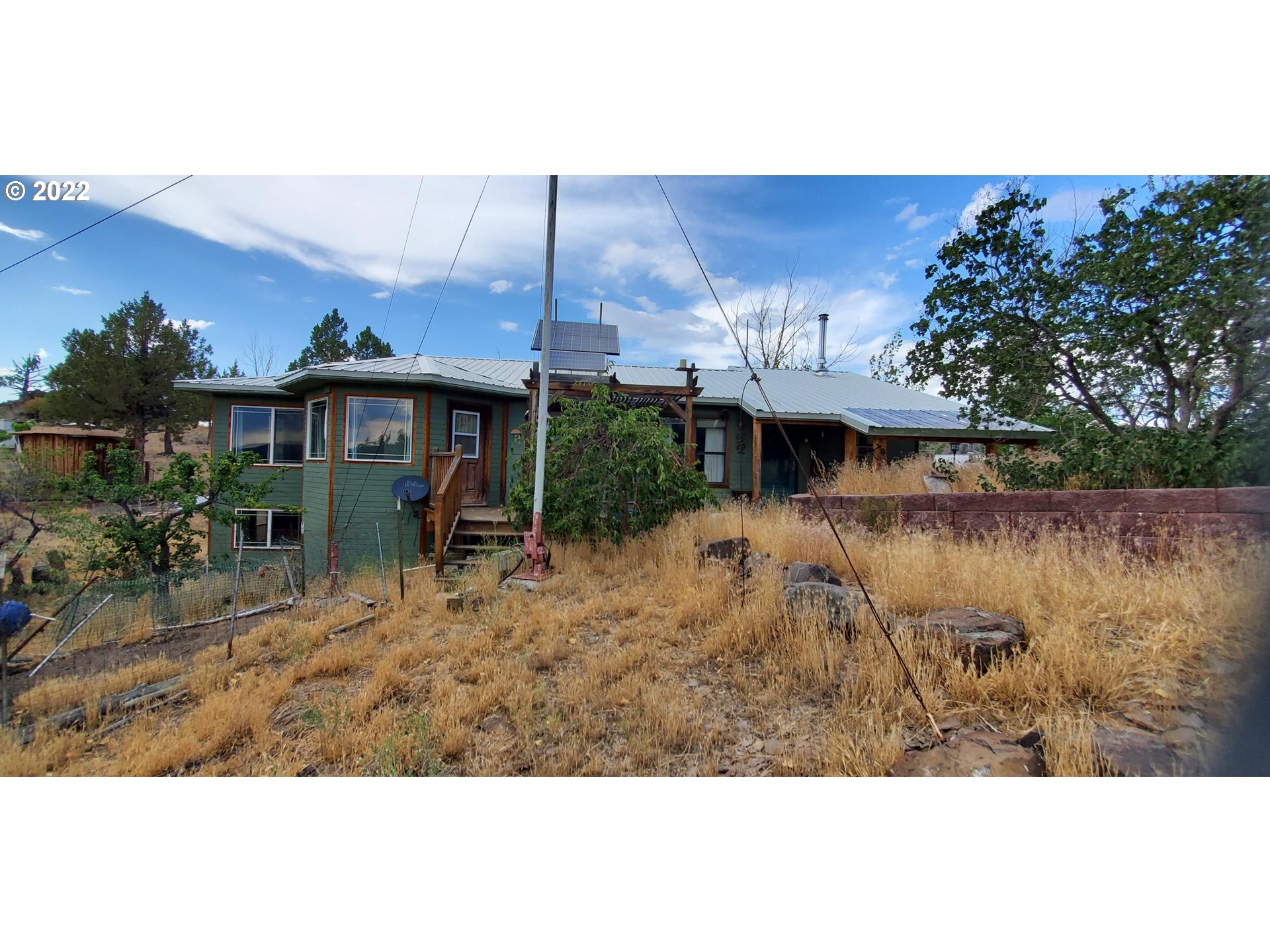 18990 Southeast Doubtful Dirt Road Prineville, OR 97754 - Photo 4 of 32 a view of a house with a lake view