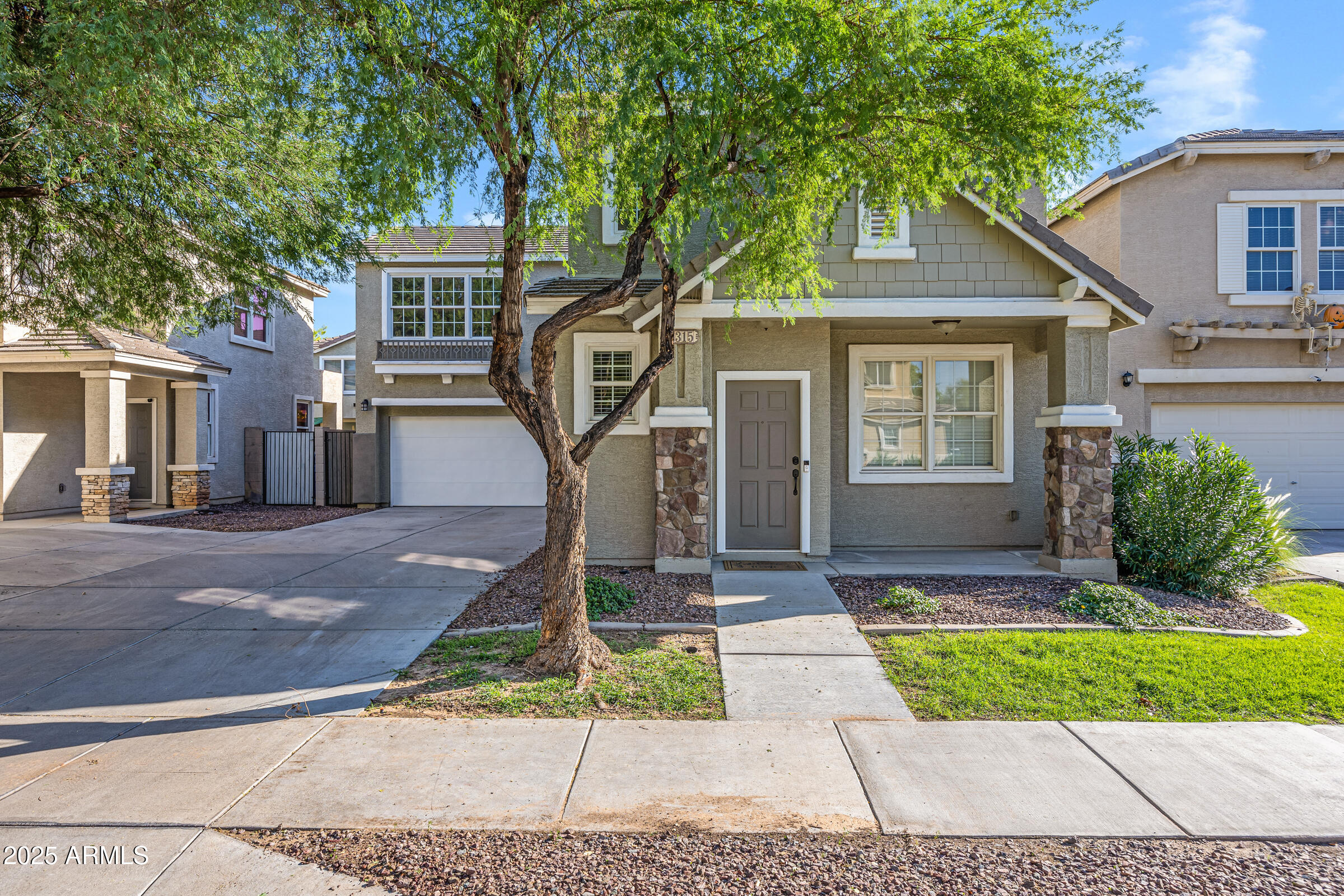 2315 East Pecan Road Phoenix, AZ 85040 - Photo 1 of 36 a front view of a house with a yard