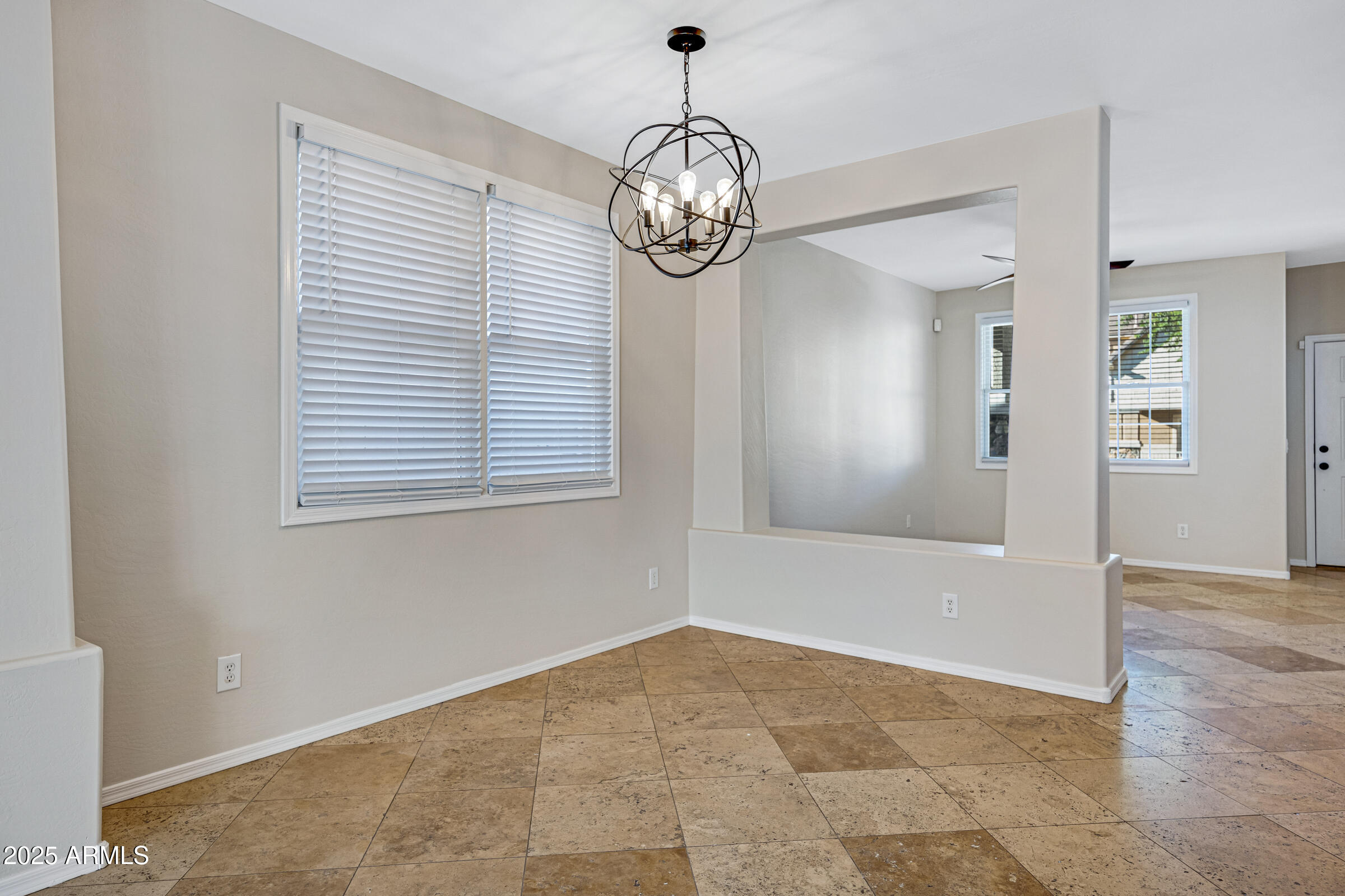 2315 East Pecan Road Phoenix, AZ 85040 - Photo 11 of 36 a view of an empty room with wooden floor and a window