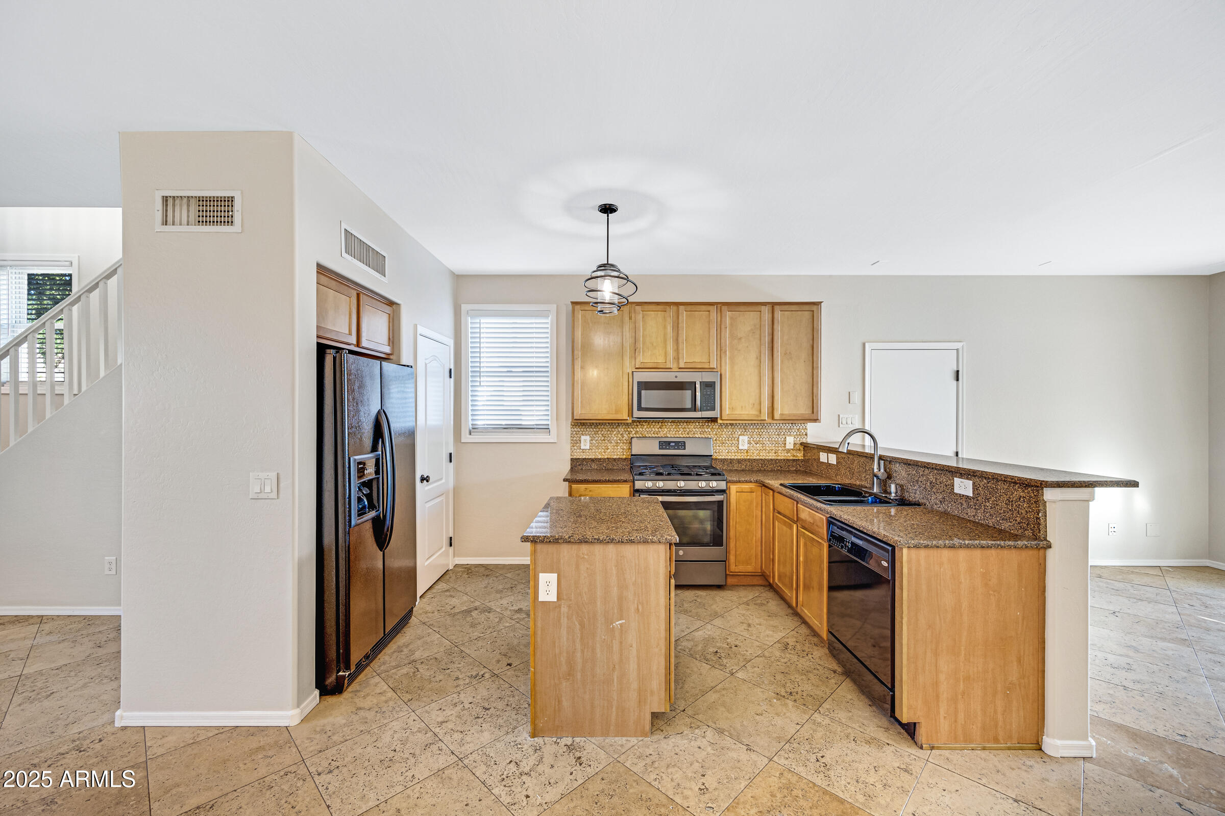 2315 East Pecan Road Phoenix, AZ 85040 - Photo 14 of 36 a kitchen with a stove a refrigerator and a stove