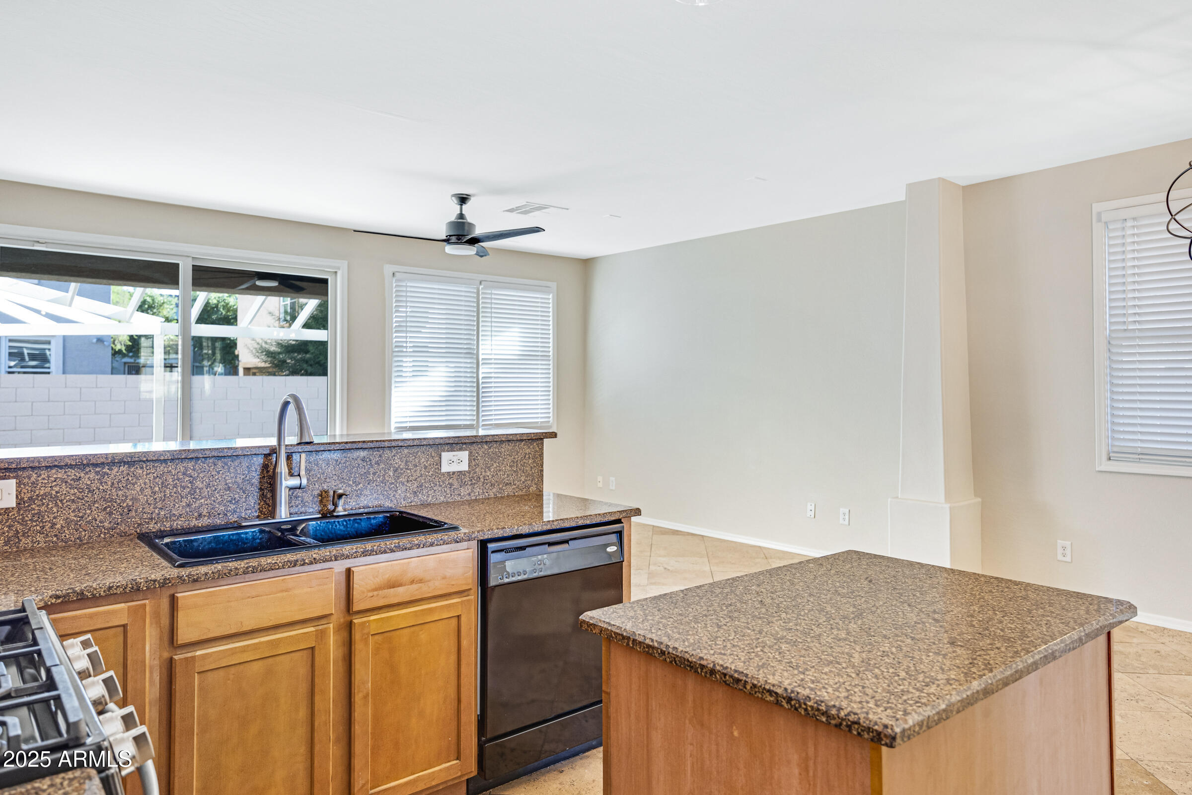 2315 East Pecan Road Phoenix, AZ 85040 - Photo 16 of 36 a kitchen with granite countertop a sink and a window