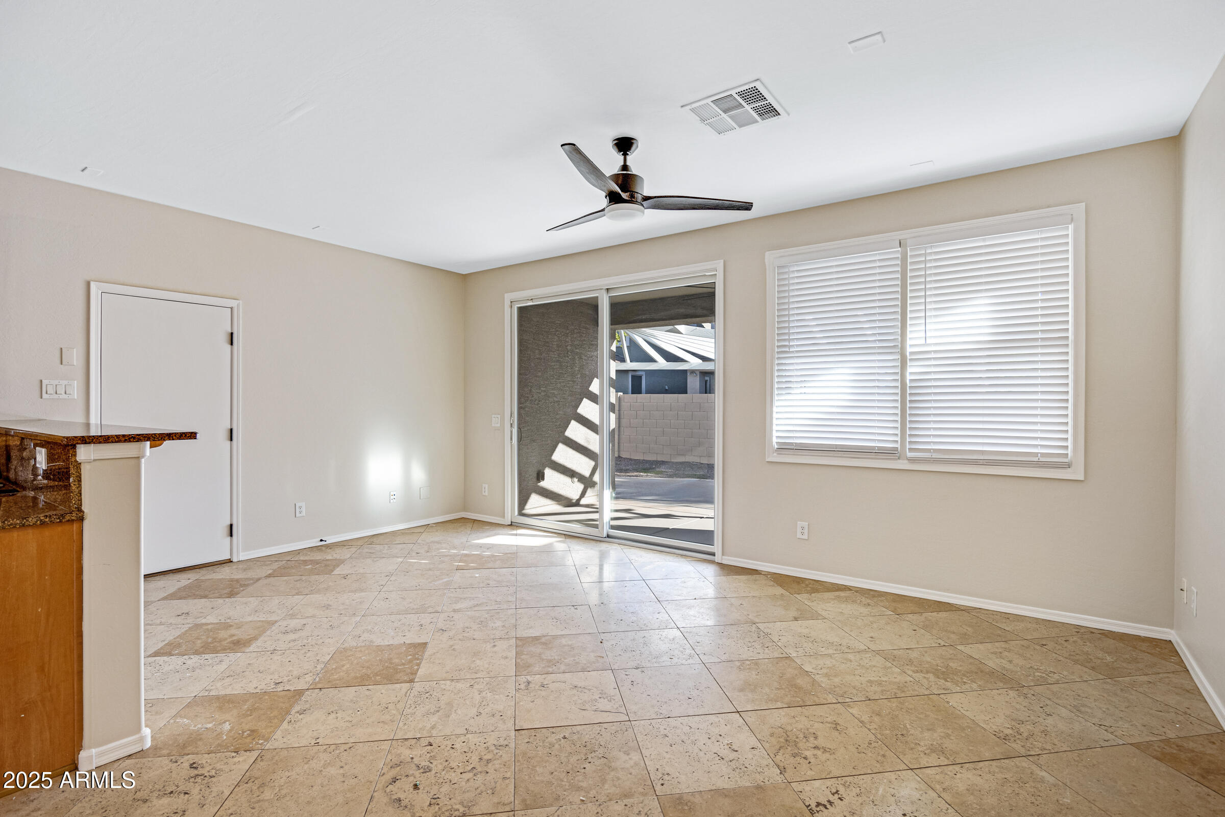 2315 East Pecan Road Phoenix, AZ 85040 - Photo 17 of 36 a view of an empty room with a window