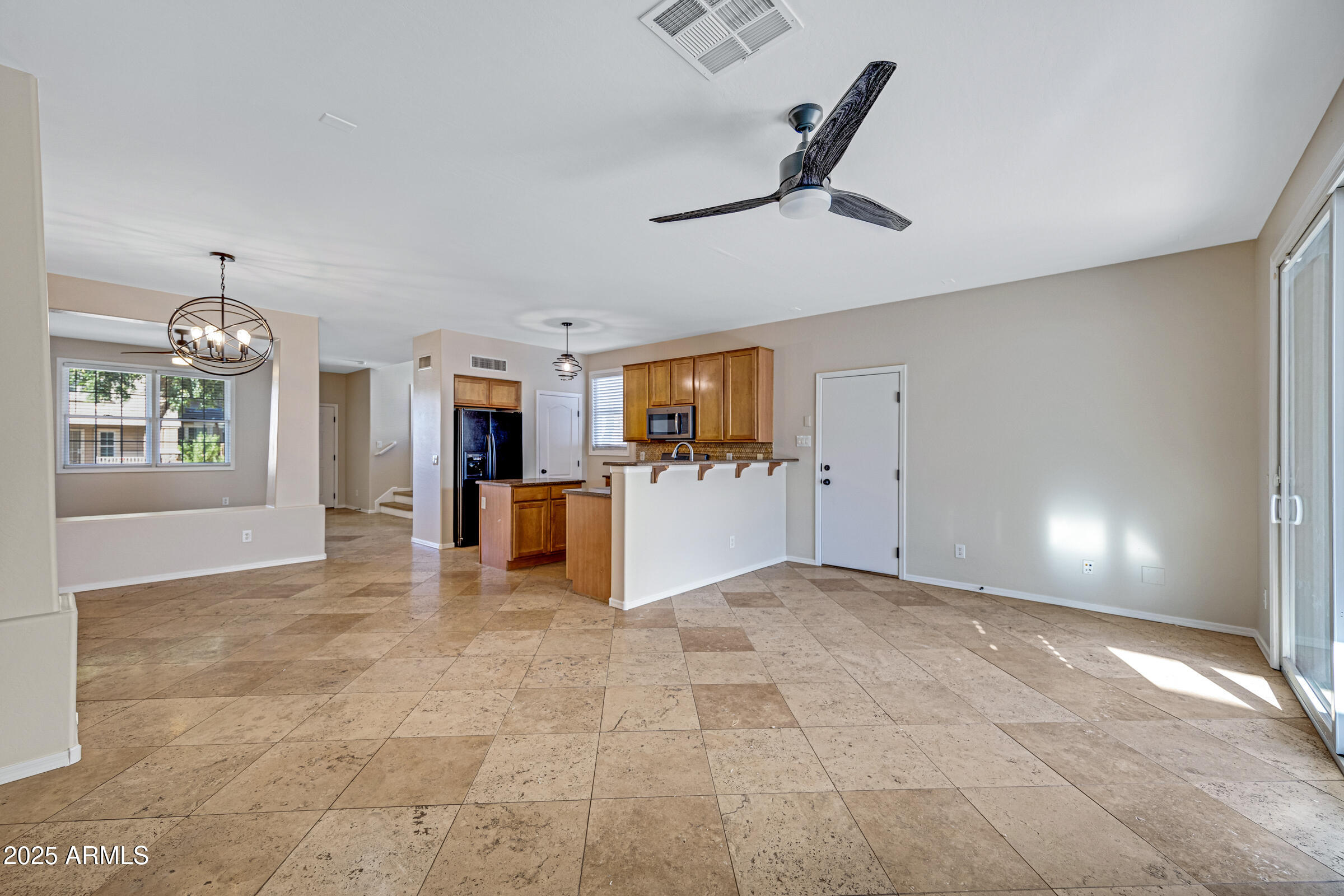 2315 East Pecan Road Phoenix, AZ 85040 - Photo 19 of 36 a view of a livingroom with furniture and a kitchen