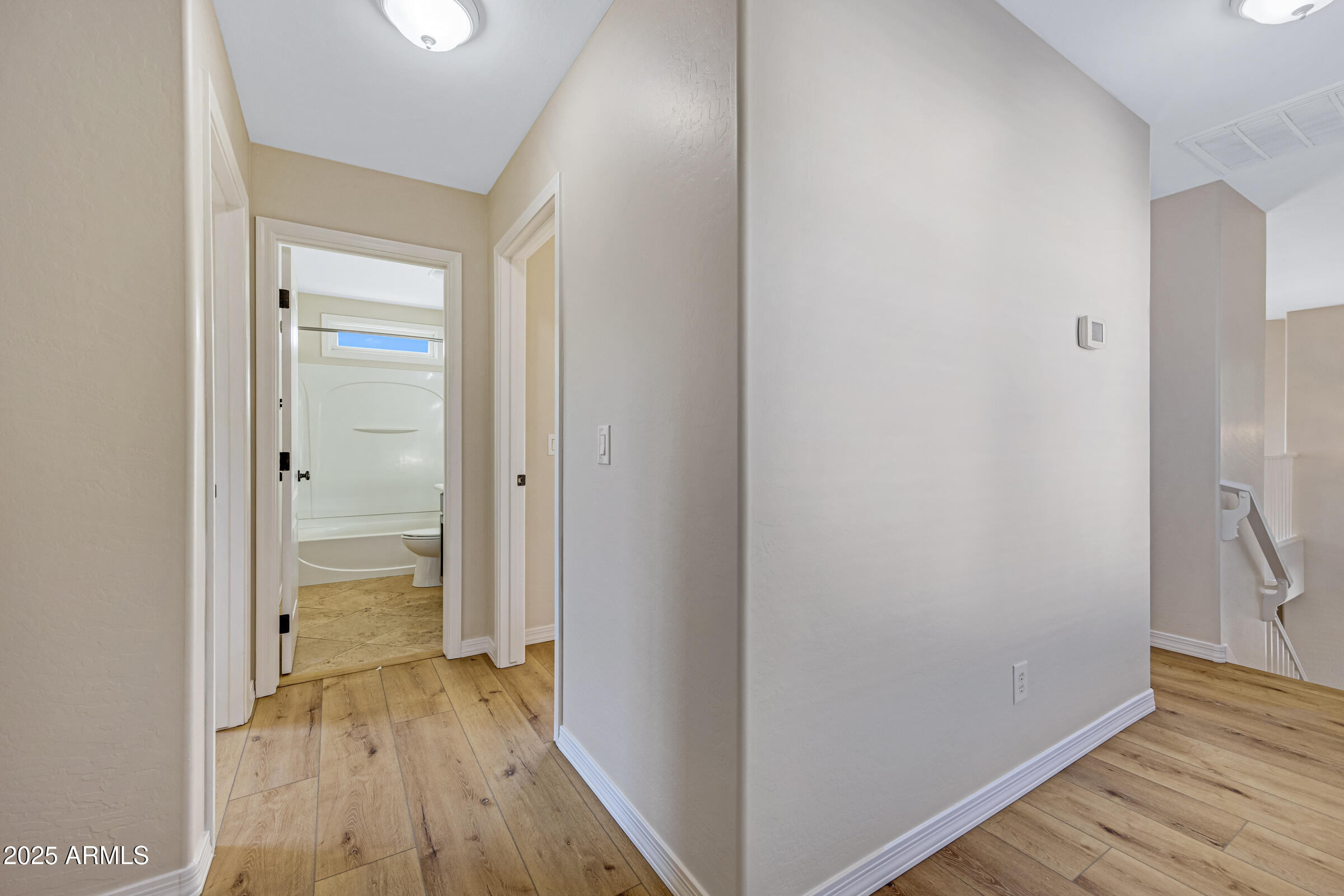 2315 East Pecan Road Phoenix, AZ 85040 - Photo 24 of 36 a view of a hallway with wooden floor
