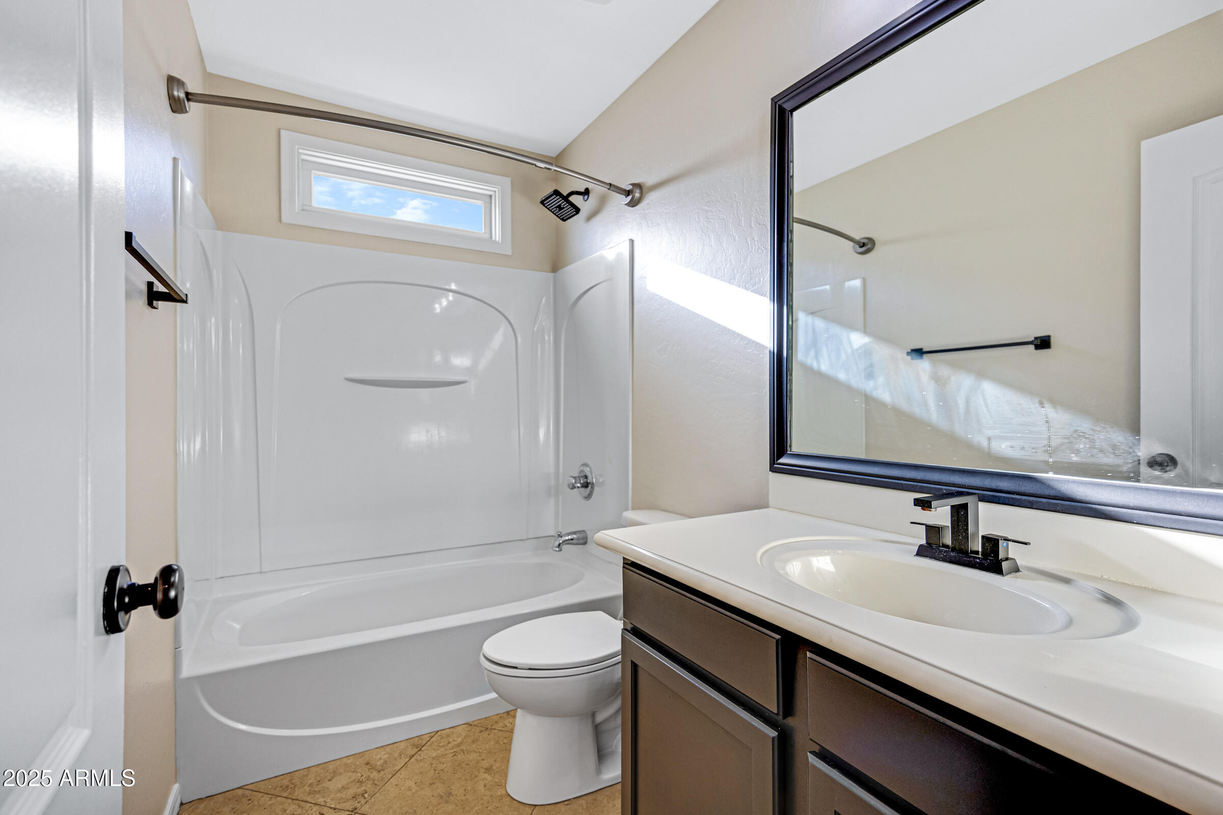 2315 East Pecan Road Phoenix, AZ 85040 - Photo 28 of 36 a bathroom with a sink a toilet a mirror and shower
