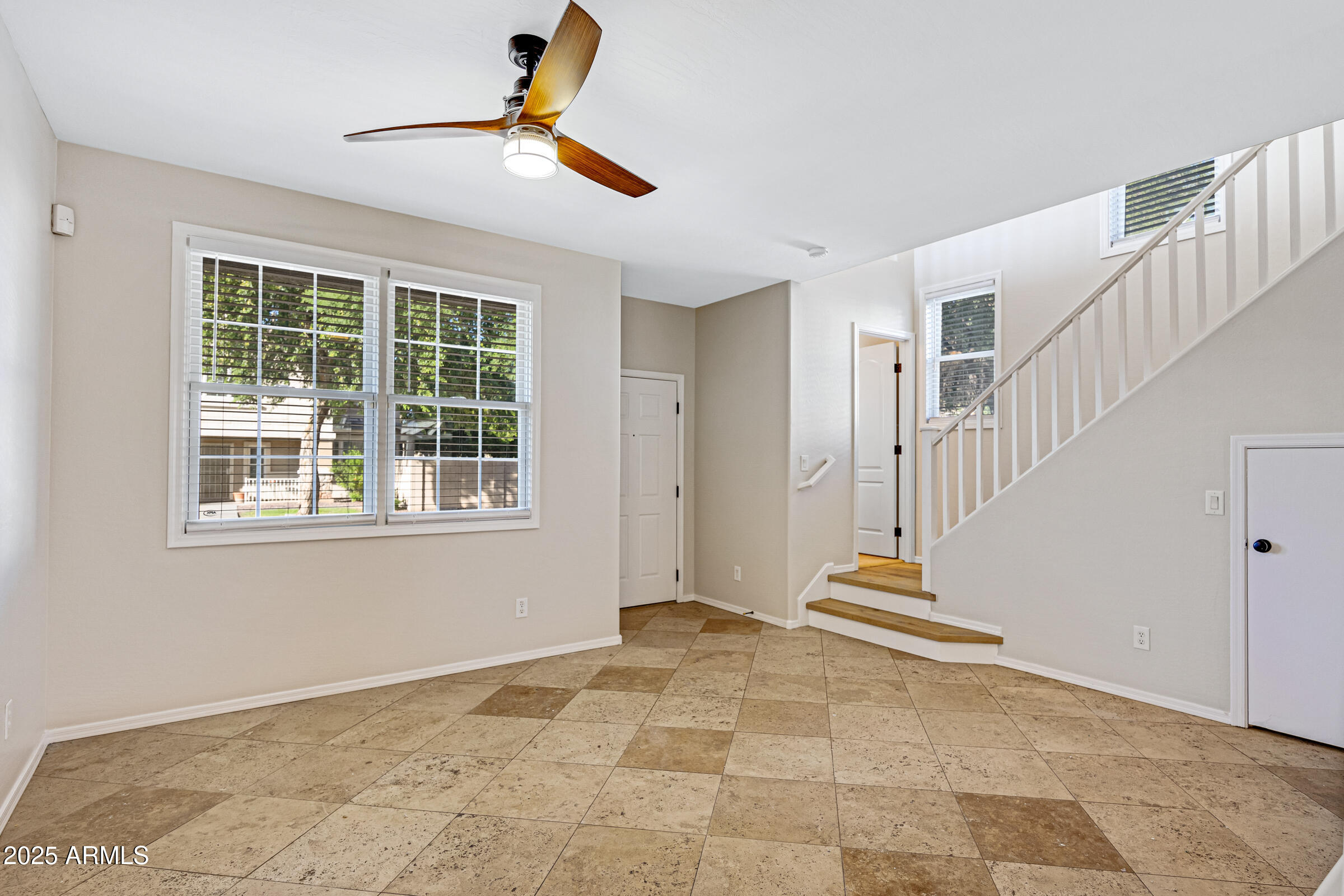 2315 East Pecan Road Phoenix, AZ 85040 - Photo 7 of 36 a view of an empty room with stairs