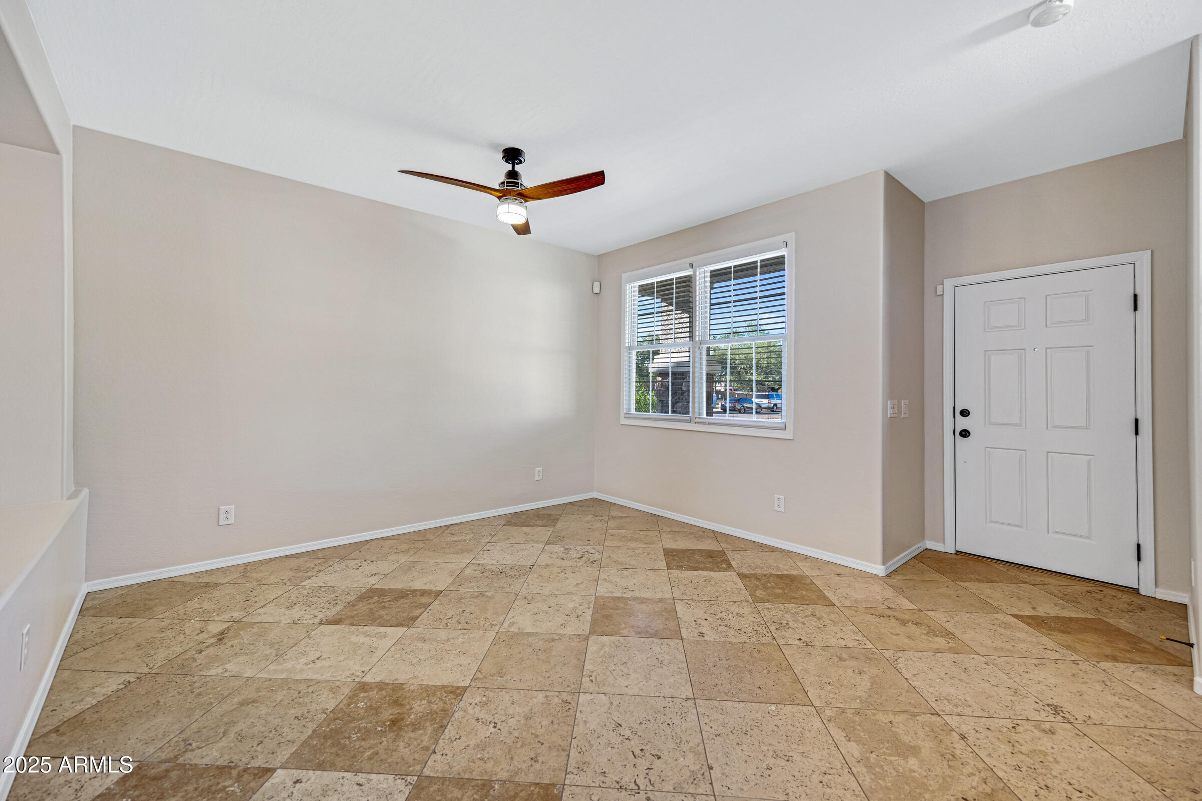 2315 East Pecan Road Phoenix, AZ 85040 - Photo 8 of 36 a view of an empty room with a window