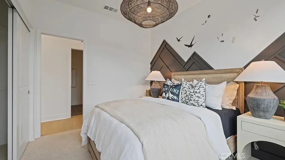 1025 Citron Road Fullerton, CA 92835 - Photo 18 of 25 a bedroom with a bed and a chandelier