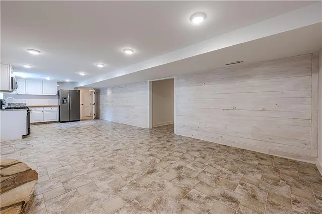 a view of a livingroom with a kitchen
