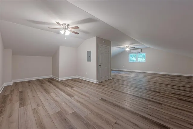 a view of a big room with windows and cabinet