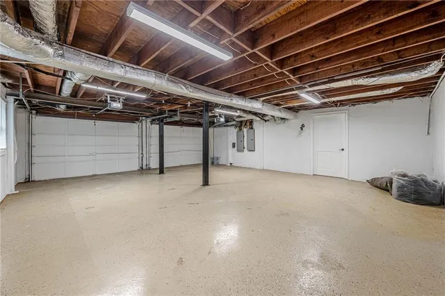 a front view of a house having yard with wooden fence