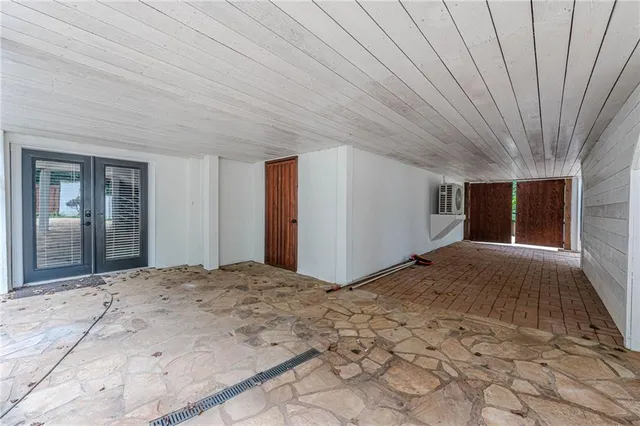 a balcony with wooden floor and fence