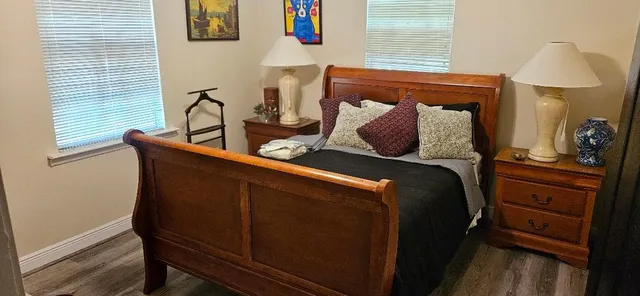 a bed room with a bed and a window