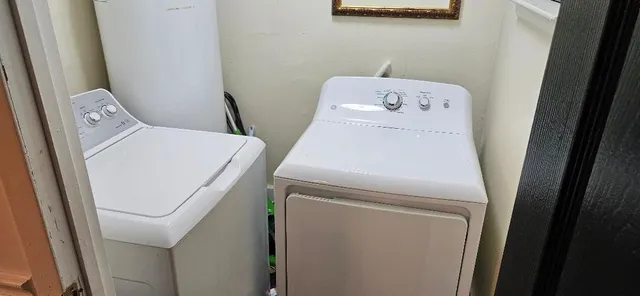 a utility room with dryer and washer