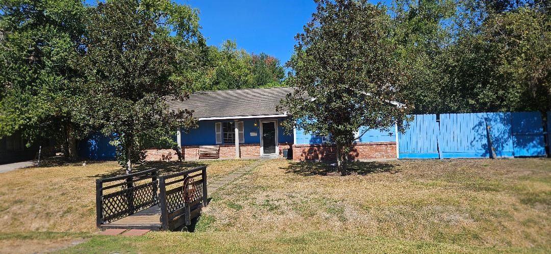 146 Hohldale Street Houston, TX 77022 - Photo 2 of 31 a view of a house with a yard covered in snow