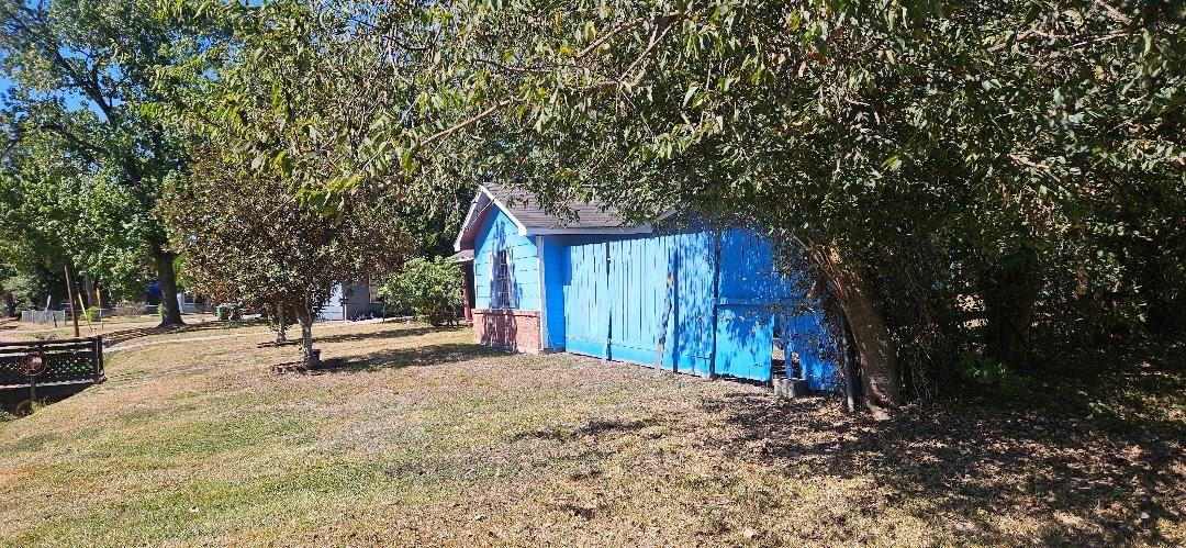 146 Hohldale Street Houston, TX 77022 - Photo 28 of 31 a backyard of a house with barbeque oven and outdoor seating