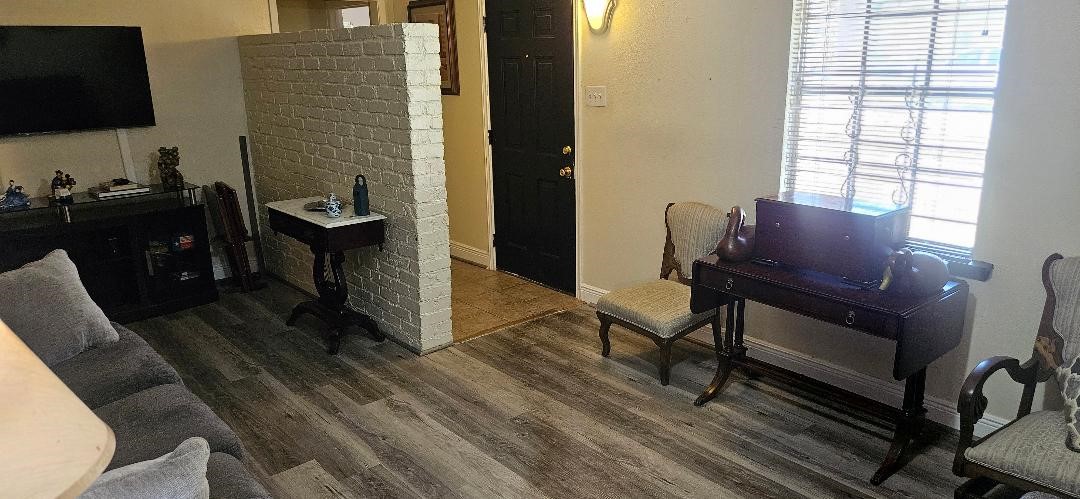 146 Hohldale Street Houston, TX 77022 - Photo 5 of 31 a view of a workspace with furniture and a window