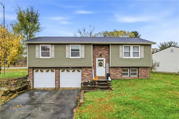 front view of a house with a yard