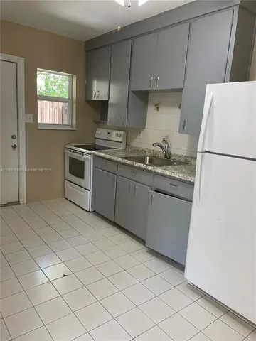 a living room with a toilet and a sink