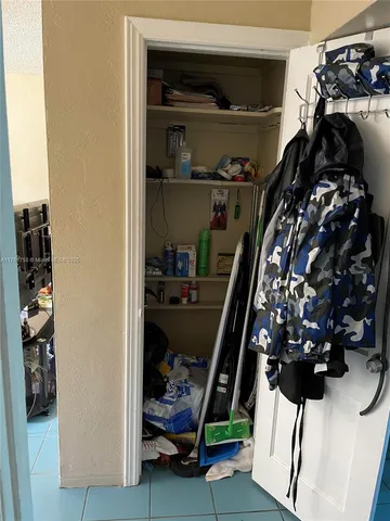 a room with furniture a window and a rug