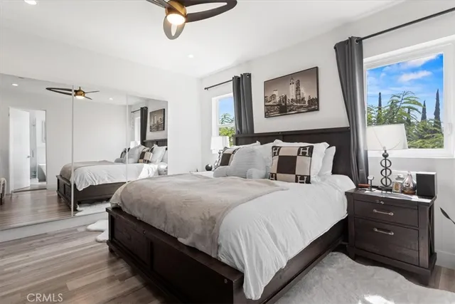 a bedroom with bed and window