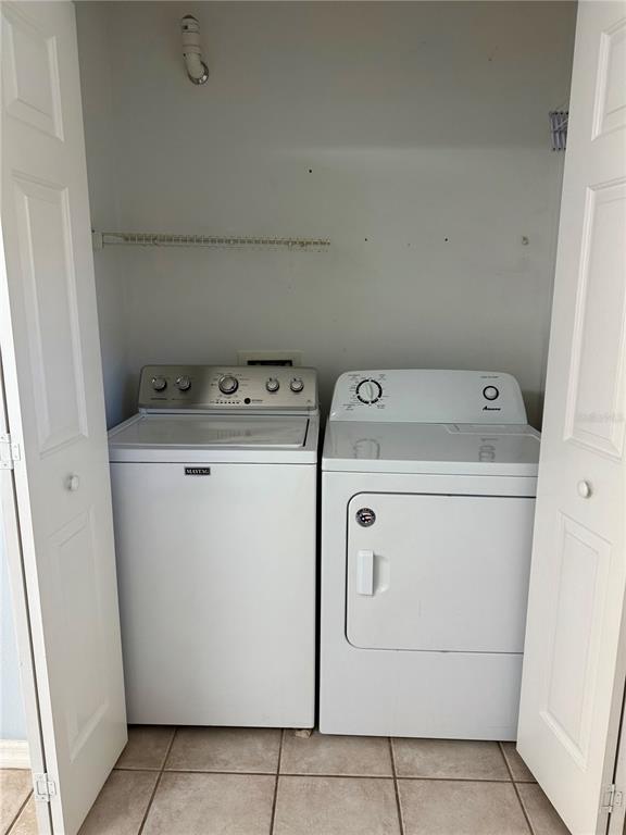 2636 Southwest 35th Place, Unit 21 Gainesville, FL 32608 - Photo 16 of 16 a utility room with dryer and washer
