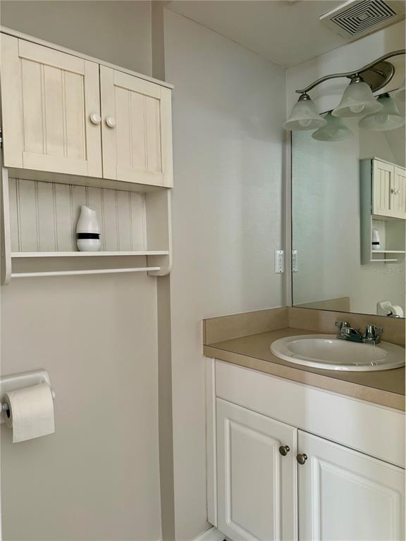 2636 Southwest 35th Place, Unit 21 Gainesville, FL 32608 - Photo 7 of 16 a bathroom with a sink and cabinets