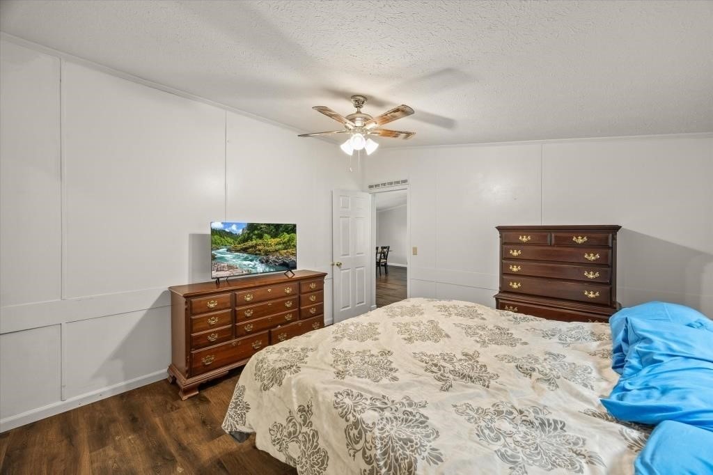 938 Riley Creek Road Whitleyville, TN 38588 - Photo 14 of 40 a bedroom with a bed dresser and a window