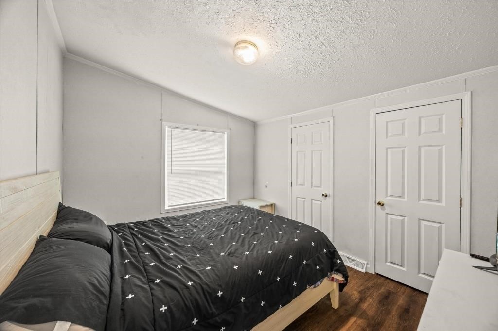 938 Riley Creek Road Whitleyville, TN 38588 - Photo 18 of 40 a bedroom with a bed and a window