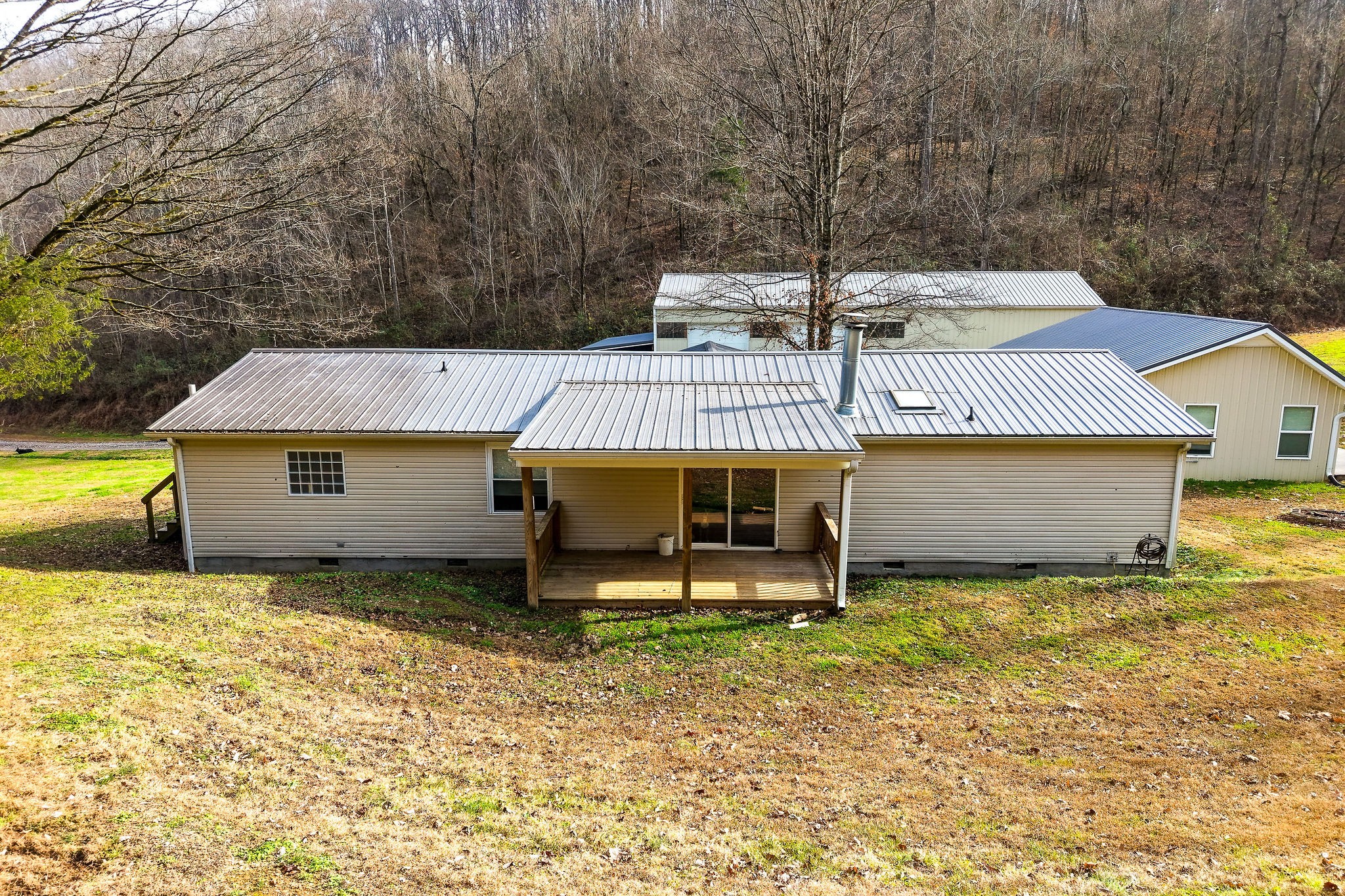 938 Riley Creek Road Whitleyville, TN 38588 - Photo 22 of 40 a view of a house with a yard