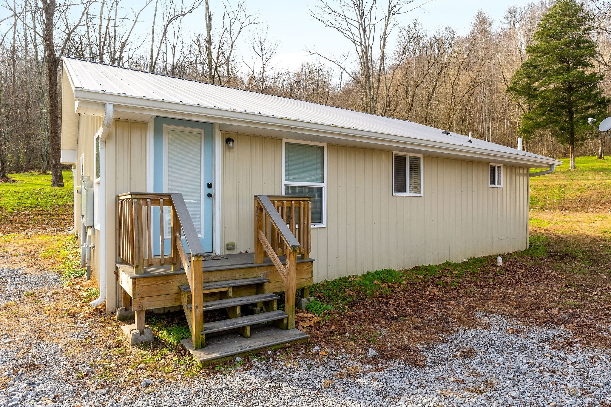 938 Riley Creek Road Whitleyville, TN 38588 - Photo 24 of 40 a front view of a house with wooden fence