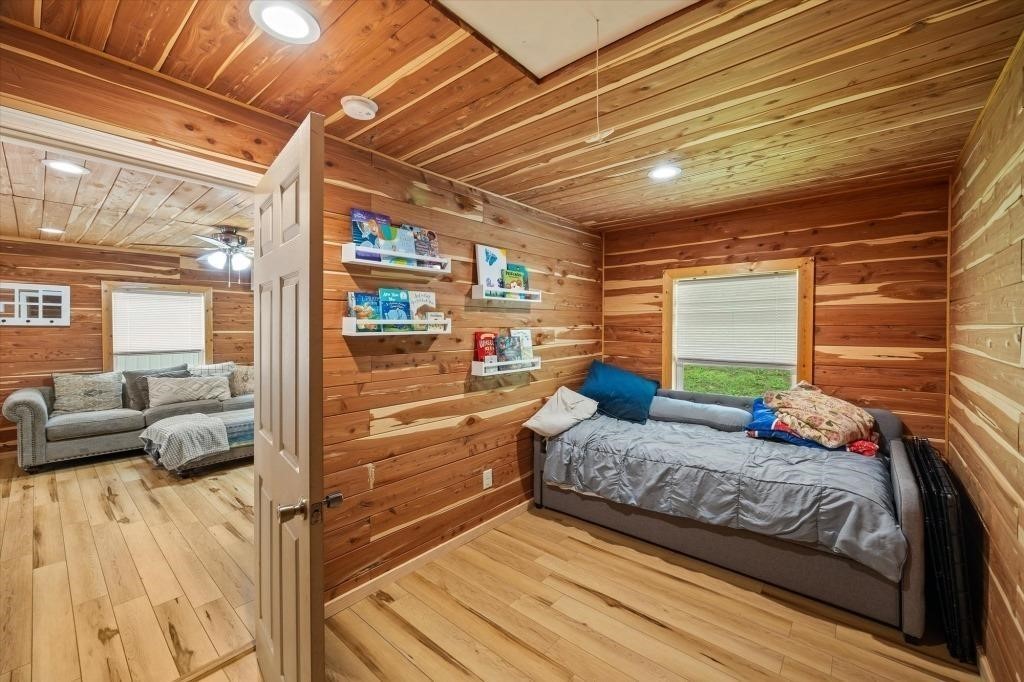 938 Riley Creek Road Whitleyville, TN 38588 - Photo 28 of 40 a bedroom with furniture and a large window