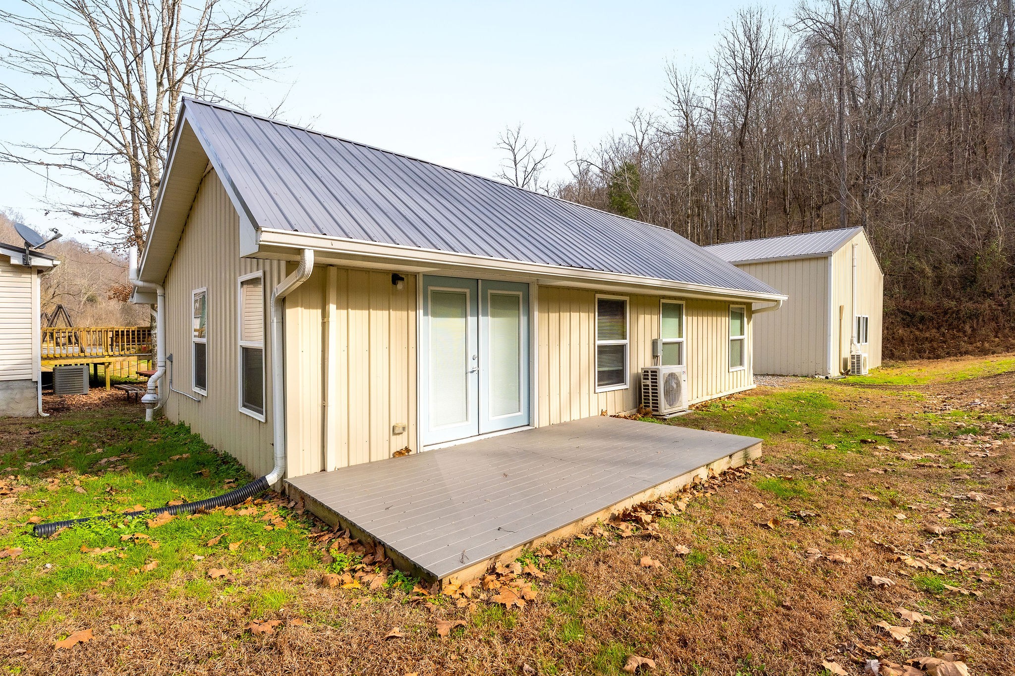 938 Riley Creek Road Whitleyville, TN 38588 - Photo 34 of 40 a front view of a house with a yard