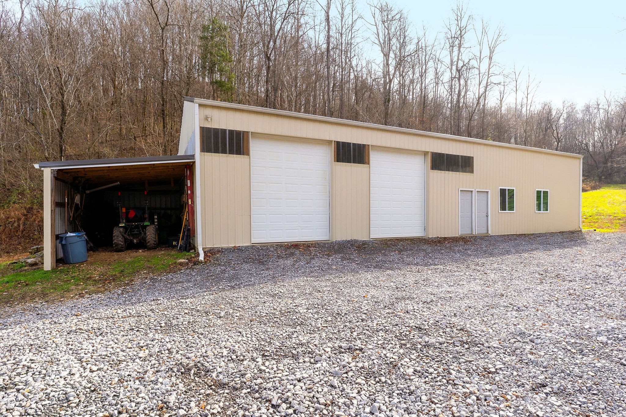 938 Riley Creek Road Whitleyville, TN 38588 - Photo 36 of 40 a view of a house with a backyard