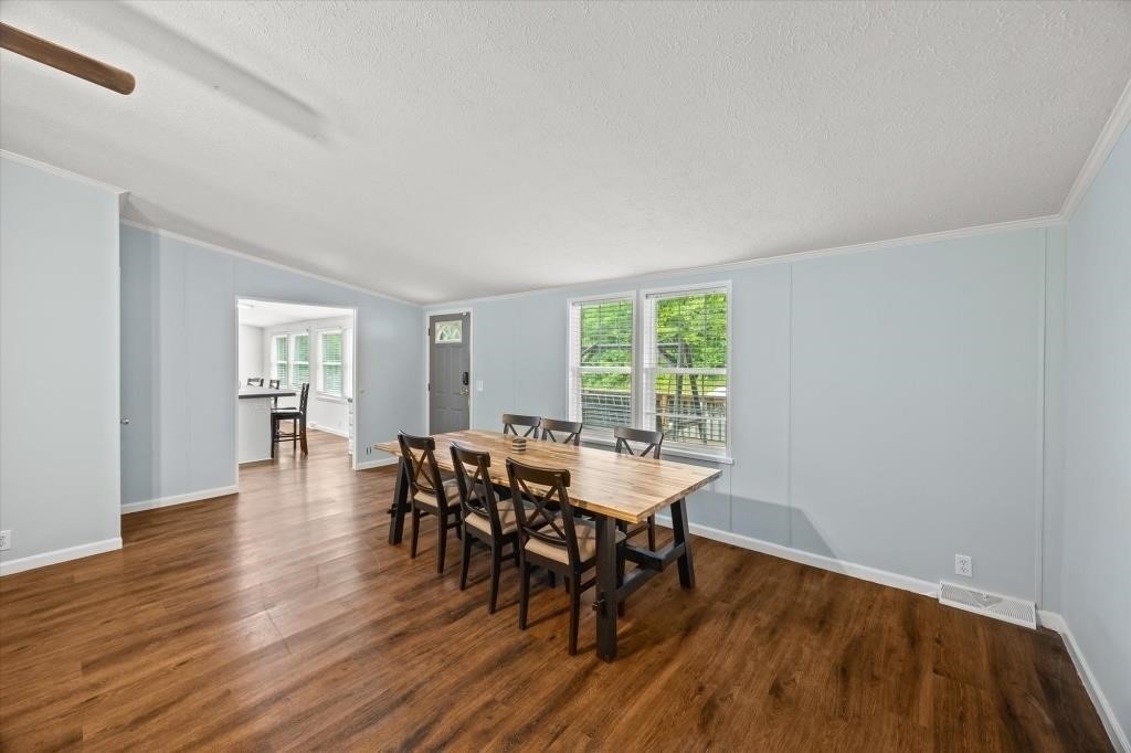 938 Riley Creek Road Whitleyville, TN 38588 - Photo 8 of 40 a dining room with furniture and wooden floor