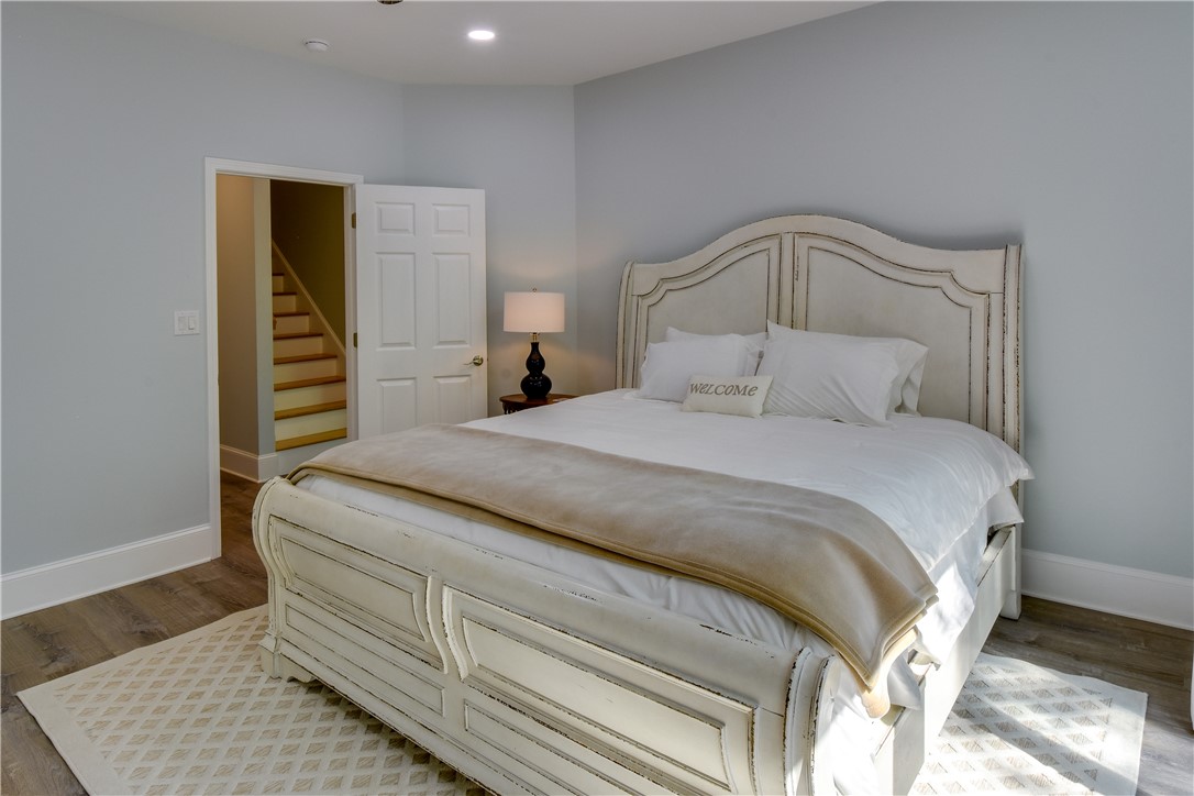 206 Petty Road Seneca, SC 29672 - Photo 26 of 48 Natural light illuminates this bedroom, offering a restful retreat with easy access to the home's additional levels.