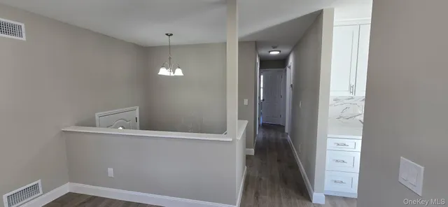 a view of a hallway with closet